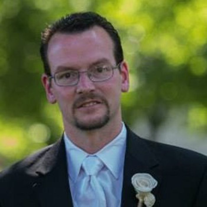 Image of John Braun in a suit.